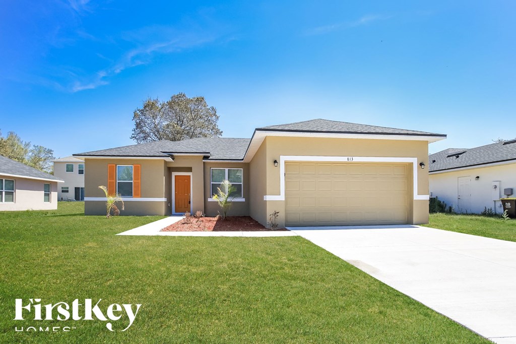 a brand new house with a garage door