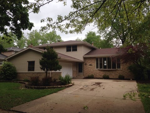 a house with a driveway in front of it