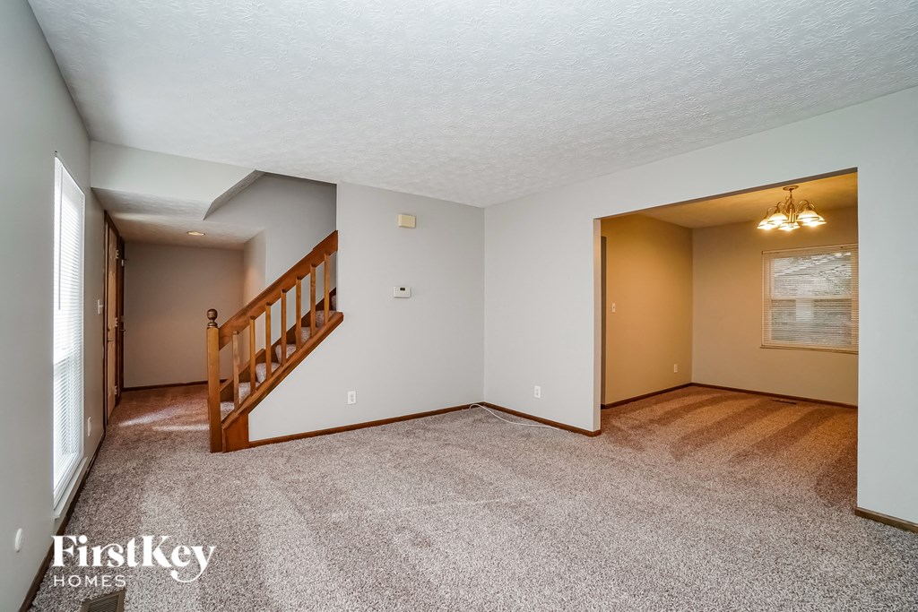 the living room and dining room are spacious and ready for entertaining