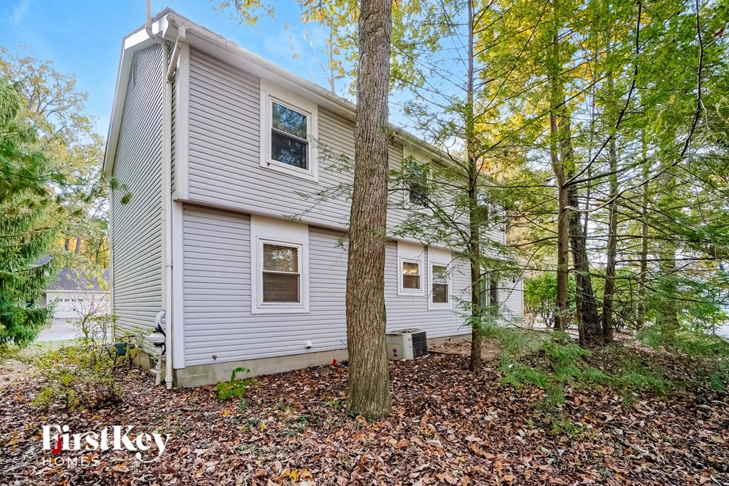 the back of a house in the woods