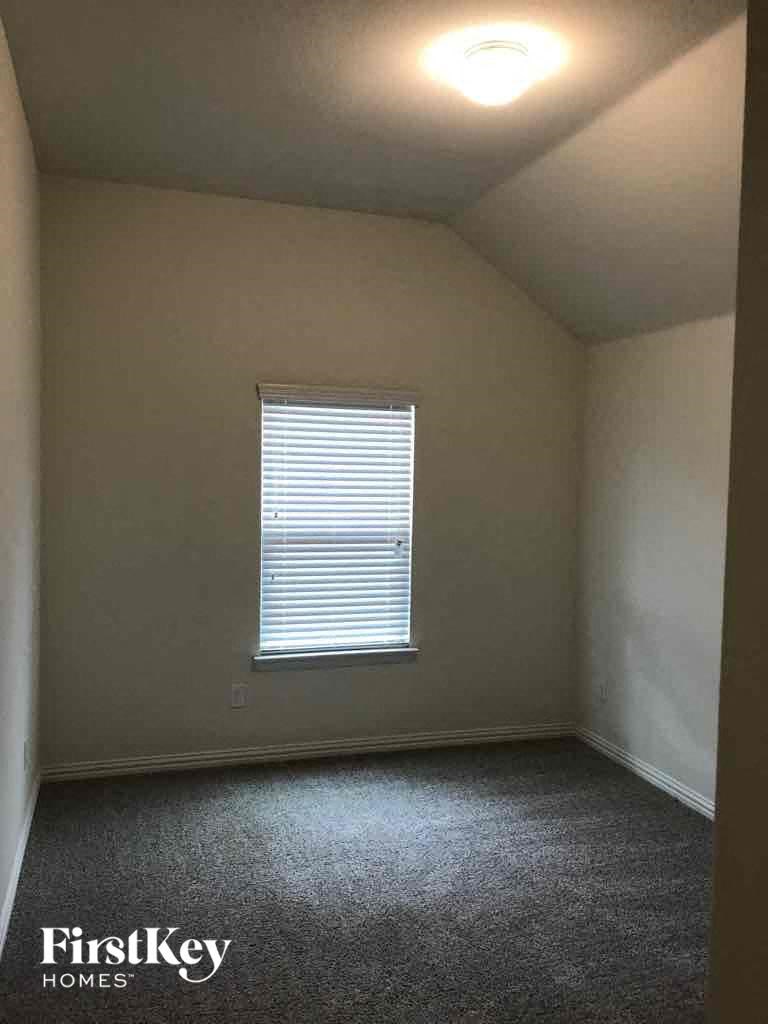 an empty room with a window in it