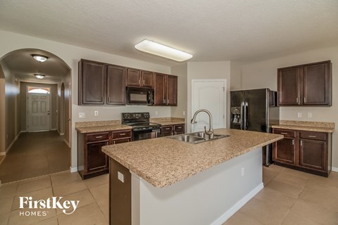 a kitchen with a granite counter top and a sink