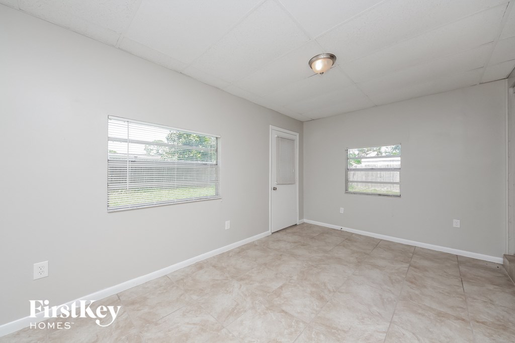 A room with a Firstkey Homes logo on the floor.