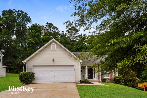 a small white house with a white garage door