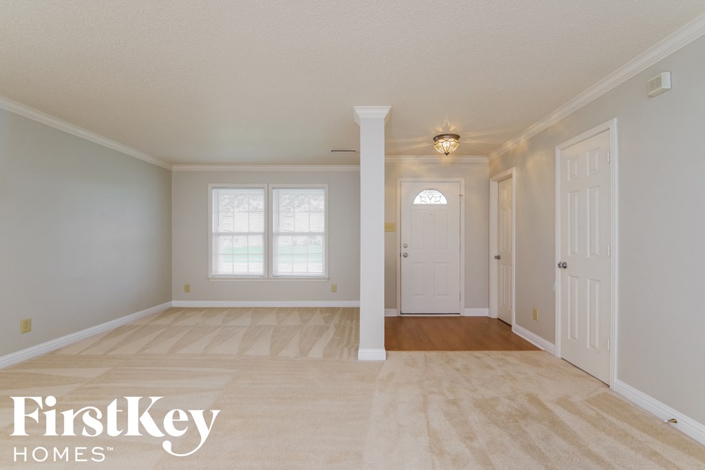 the spacious dining room is open to the hallway and living room