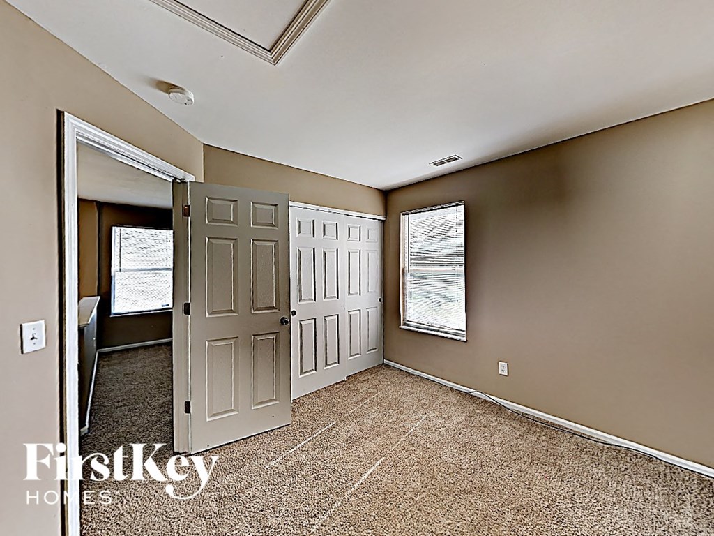 the living room of a house with a white door