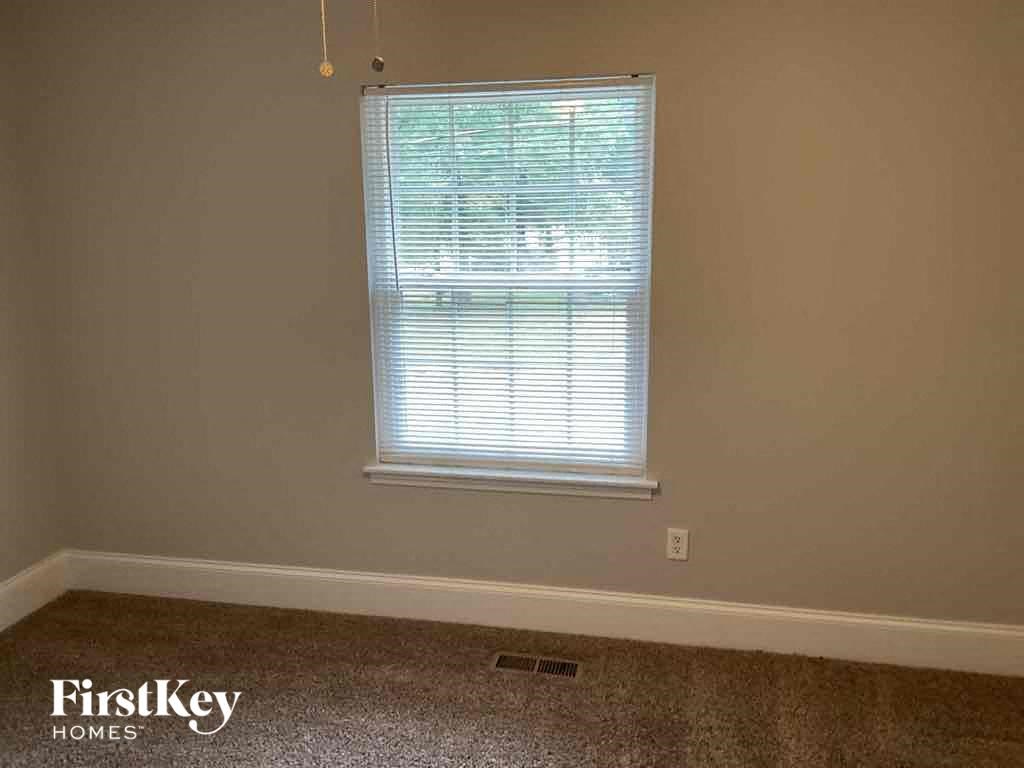 A room with a window and a FirstKey Homes logo.