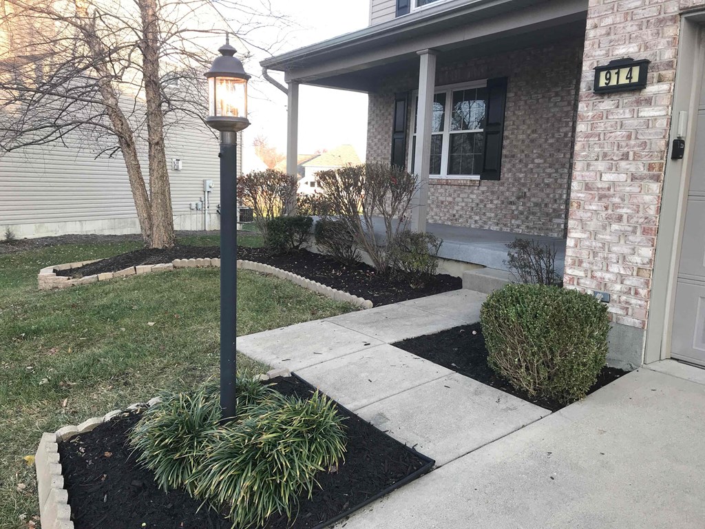 A house numbered 9144 is shown with a lamp post and a small garden in front.