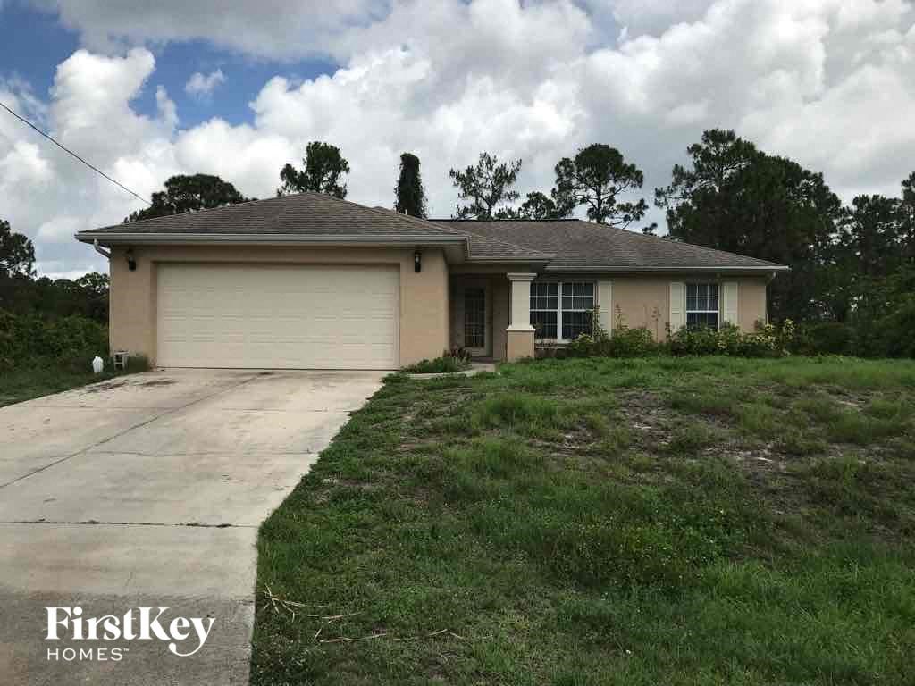 A house with a garage is for sale by FirstKey Homes.