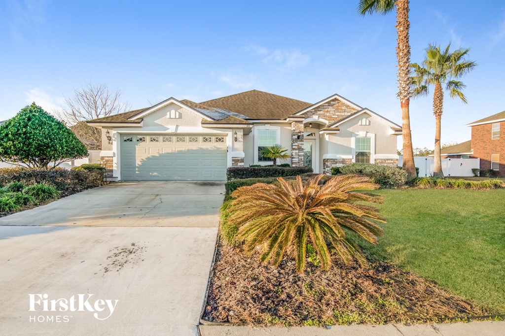 a house with palm trees in front of it