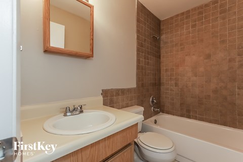 a bathroom with a sink and a toilet and a tub