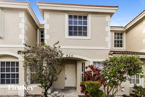 a white house with a white door and a window