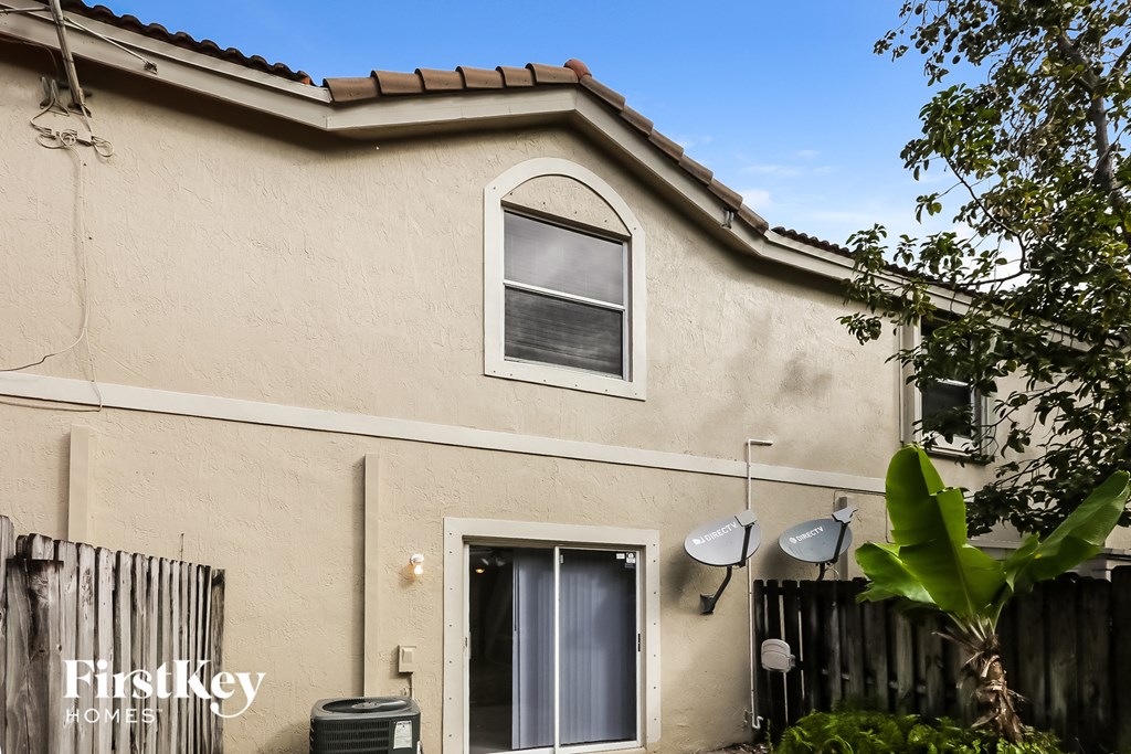 the outside of a house with a window and a door