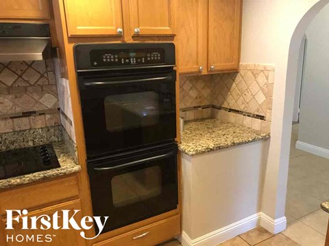 a kitchen with a black oven and a counter top
