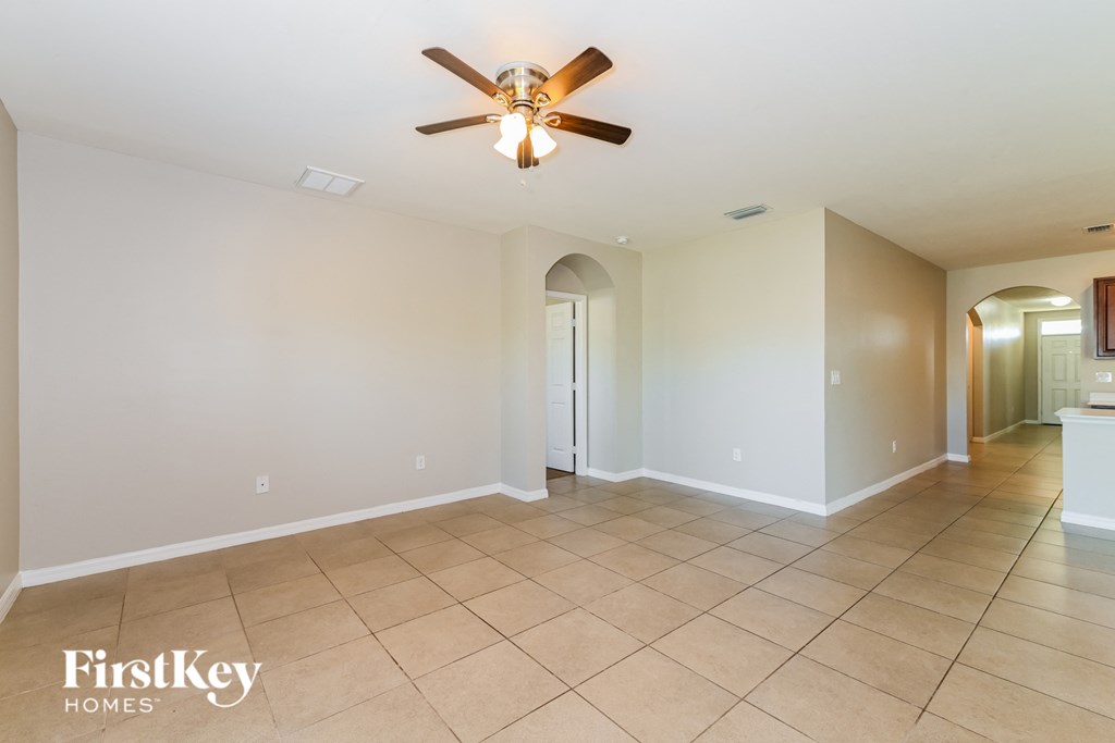 the living room and dining room are open to the hallway and kitchen
