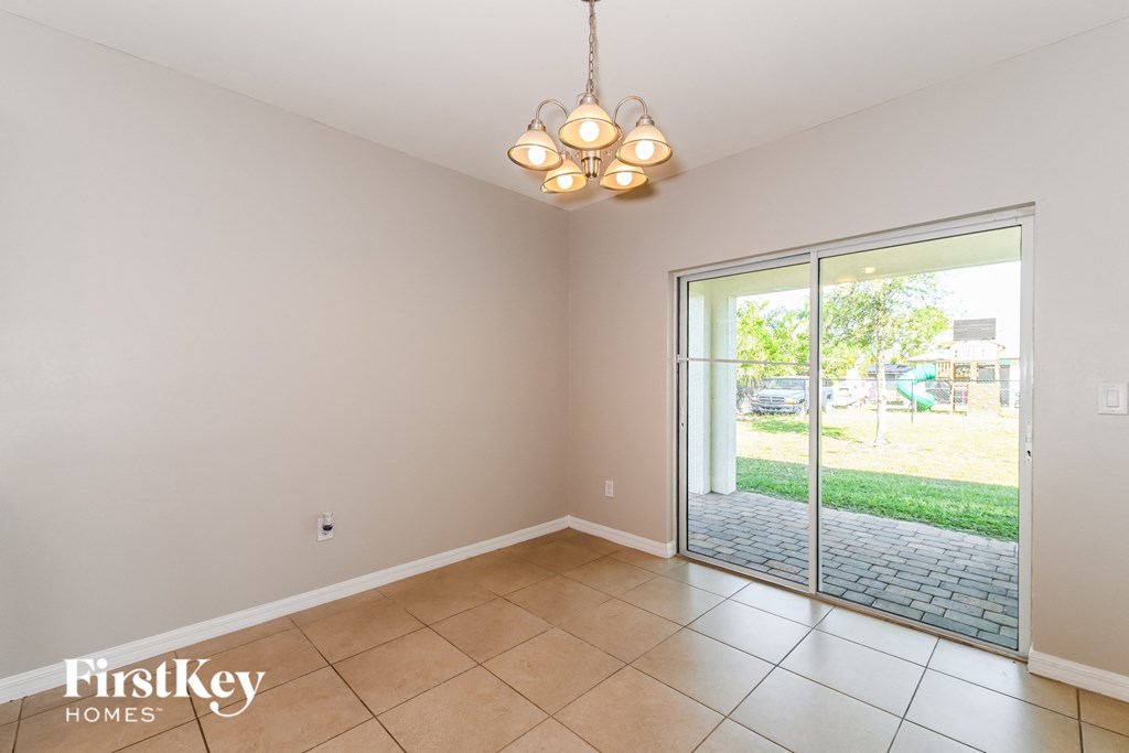a formal living room with a sliding glass door to the backyard