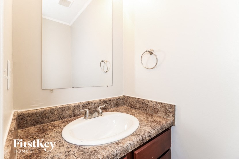 a bathroom with a sink and a mirror