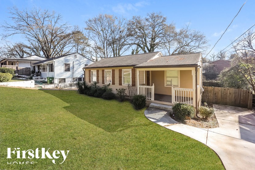A house with a lawn in front of it.