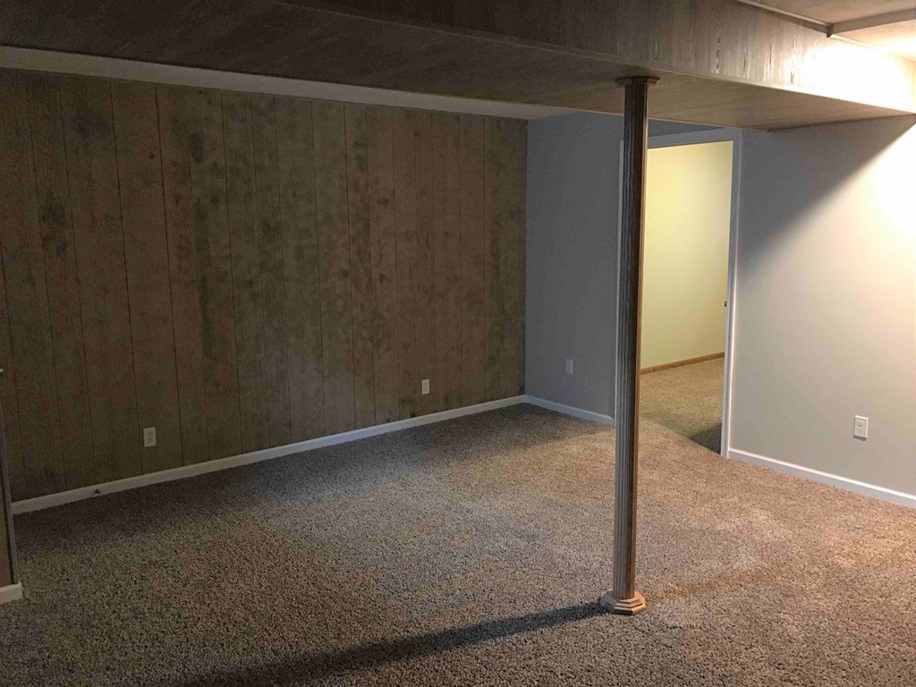 a empty room with a pole in it