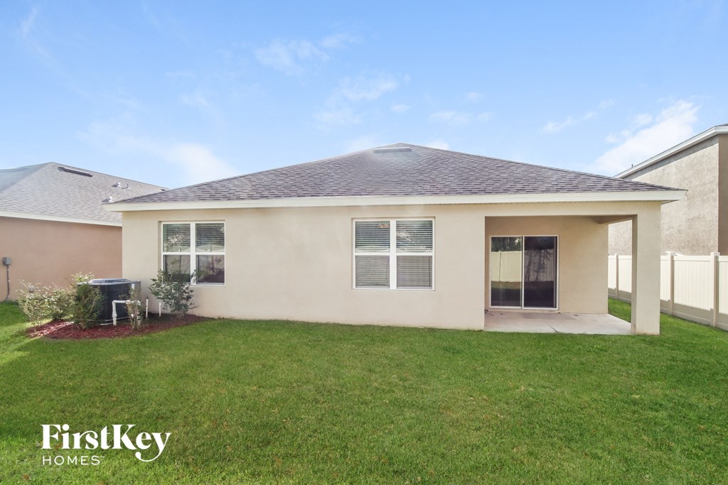 a home with a lawn and a patio