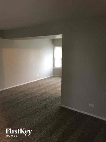 an empty living room with a window