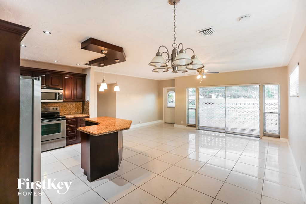 a large kitchen with a island in the middle