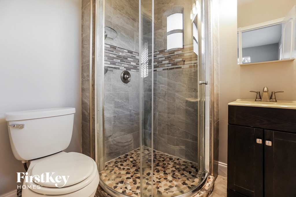 a small bathroom with a toilet and a shower