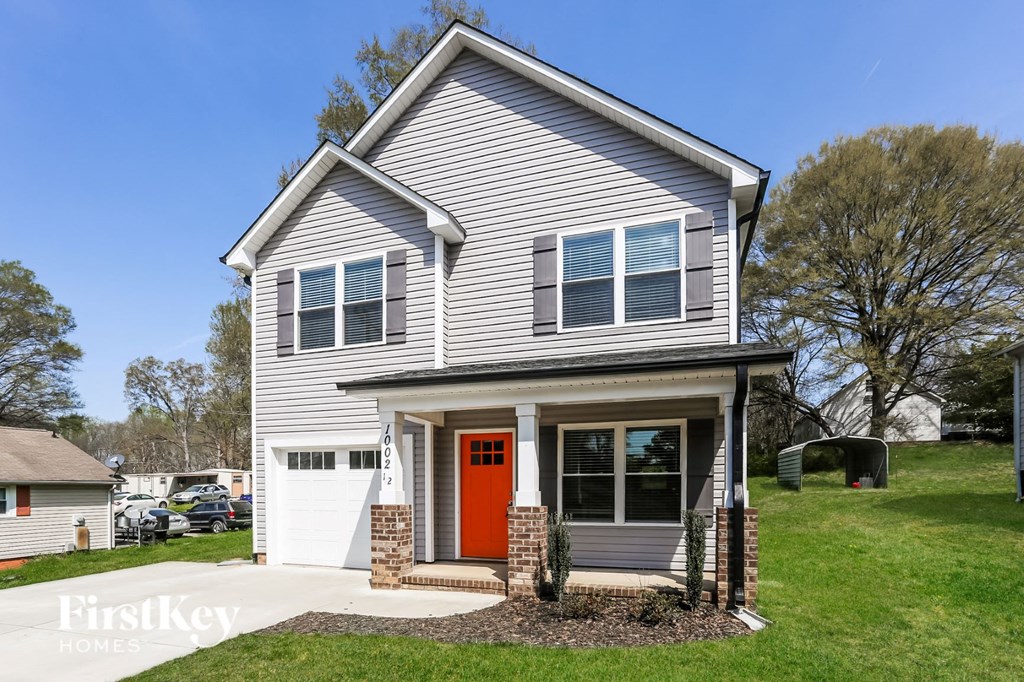 a house with a red door on the front of it
