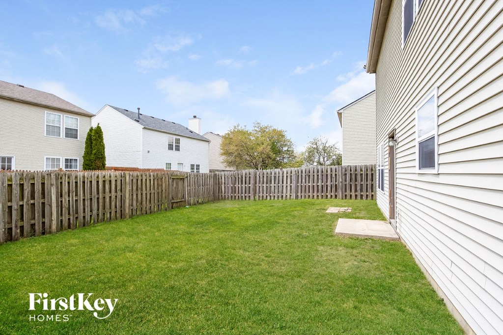 a fisheye view of a backyard with a wooden fence