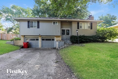 a house with a driveway and a garage door
