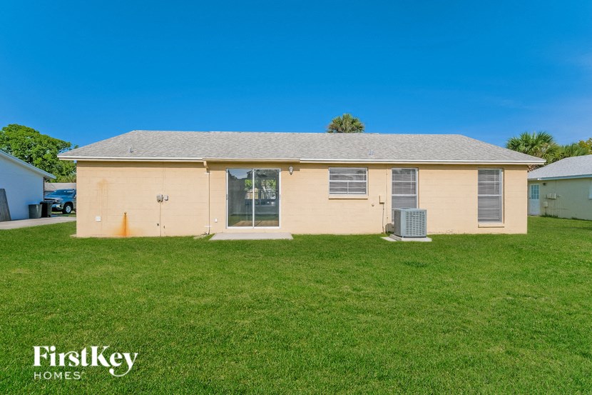 A house with a lawn in front of it.