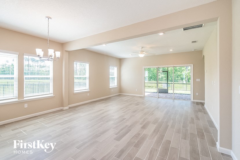 the living room and dining room are spacious and open to the backyard