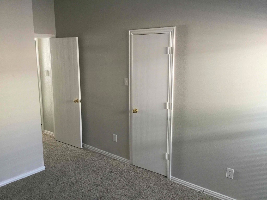 a pair of white doors in a room