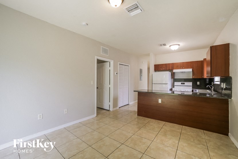 a kitchen with a counter top and a refrigerator