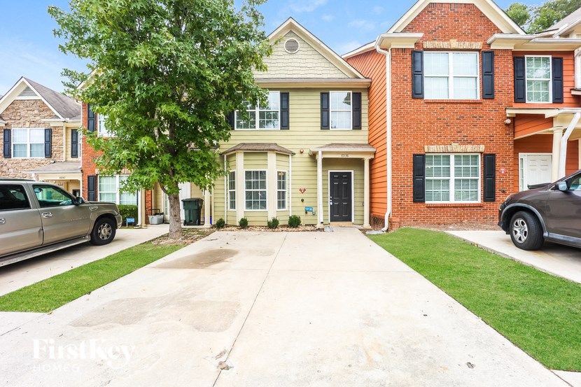 a clean driveway in front of a house