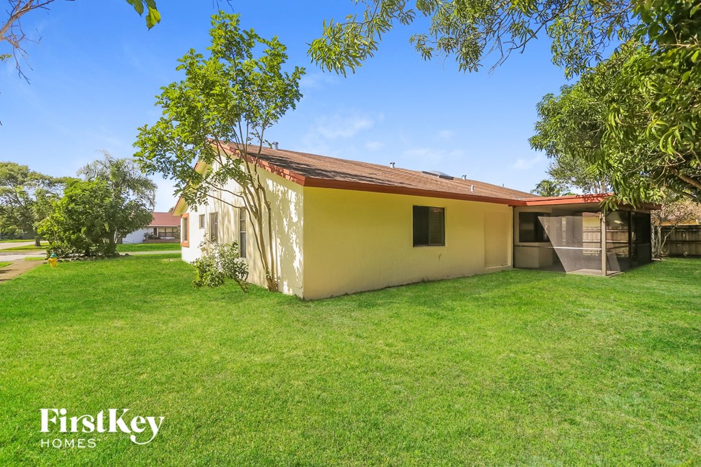 A house with a lawn in front of it.