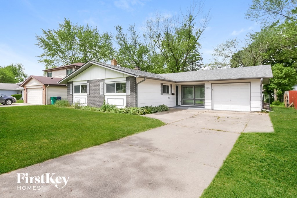 A house with a driveway in front of it.