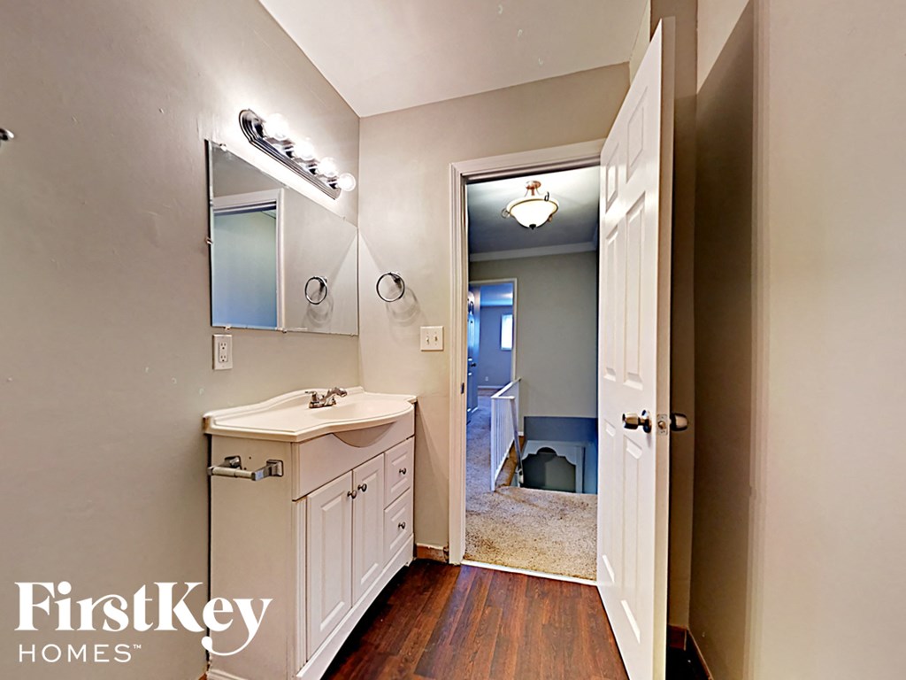 a small bathroom with a sink and a mirror and a toilet