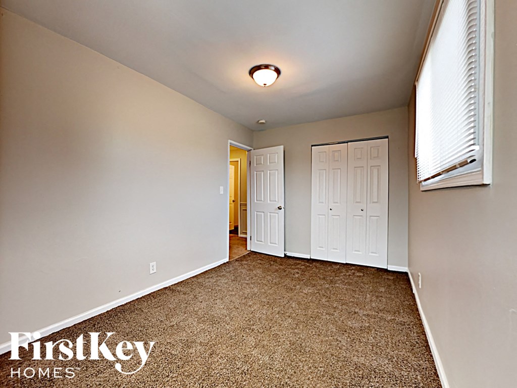 the master bedroom is spacious and has a door to the ensuite bathroom