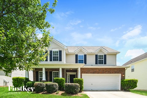 A house with a garage is for sale by FirstKey Homes.