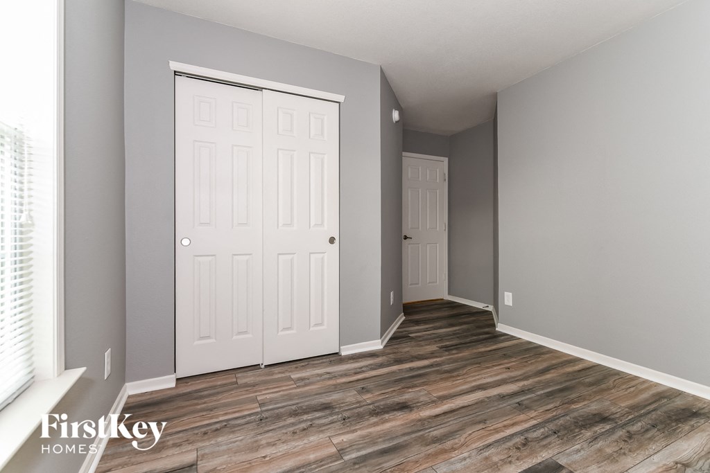 the second bedroom has a closet and a door to the bathroom