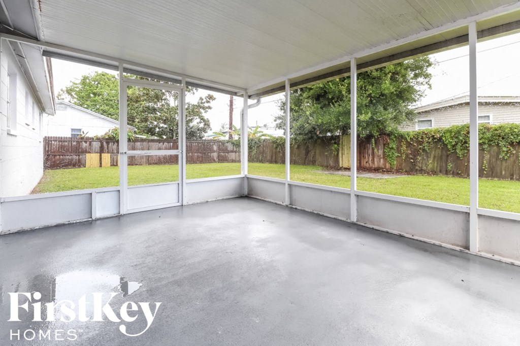 a covered patio in a home with glass windows