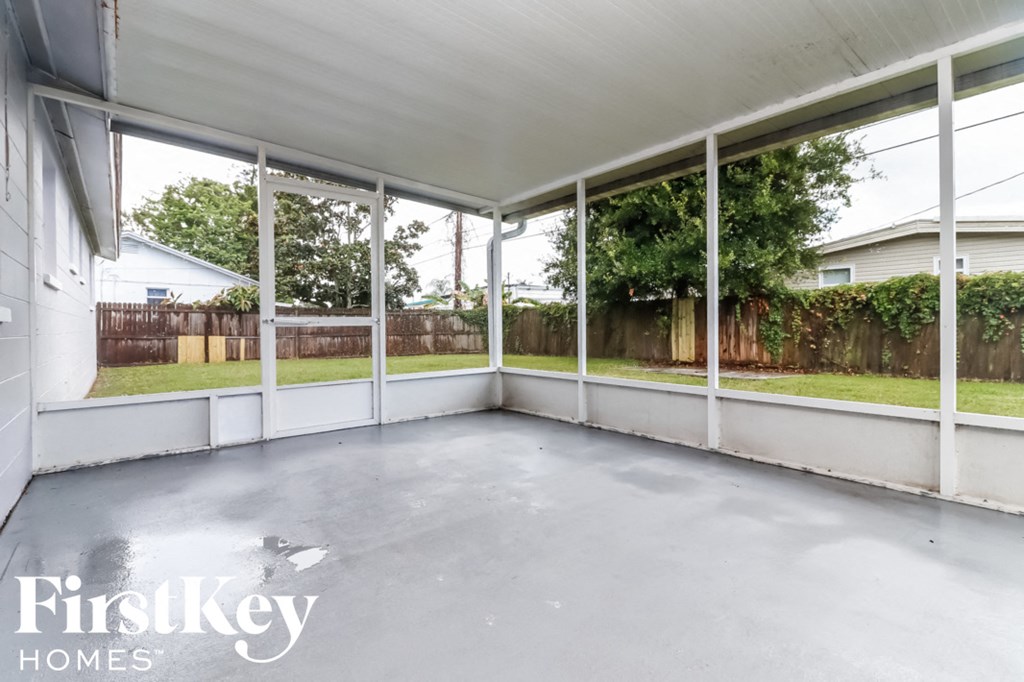 a patio in a home with large glass windows