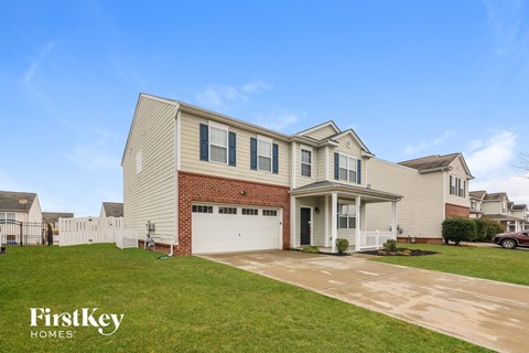 A house with a garage is for sale by FirstKey Homes.