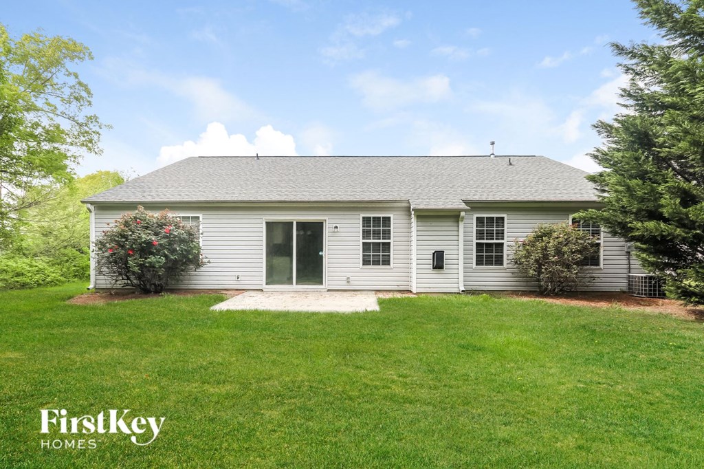 A house with a lawn in front of it.