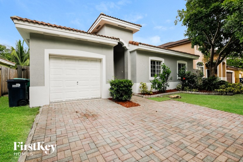 A house with a driveway in front of it.