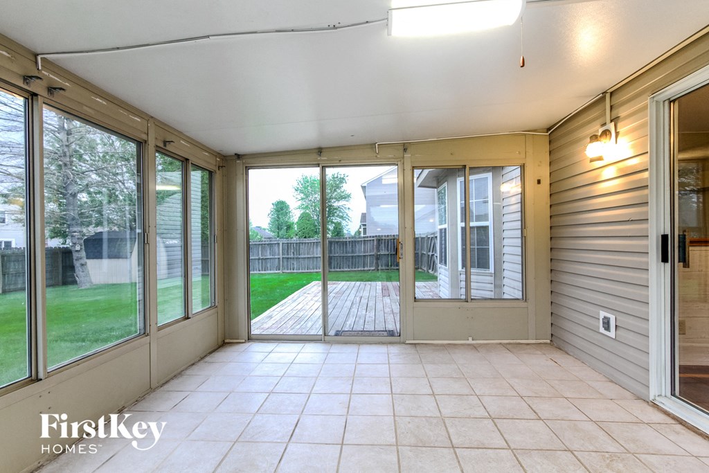 the screened porch is open to the back yard