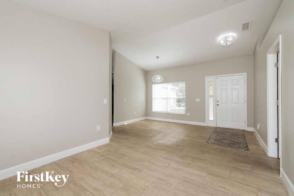 the living room and dining room are spacious and clean