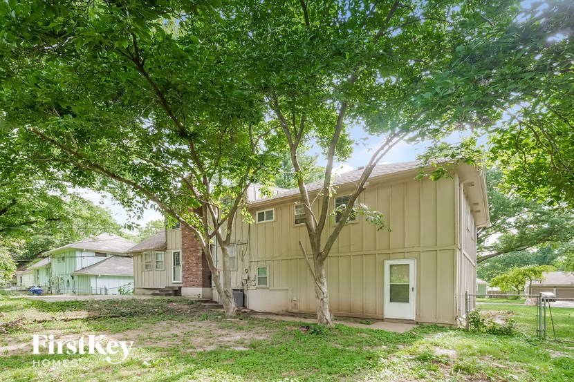 a small house with trees in front of it