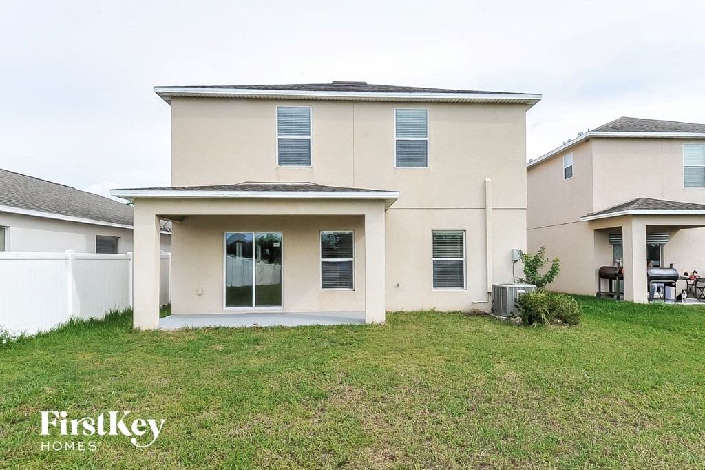 the exterior of a house with a lawn and a porch
